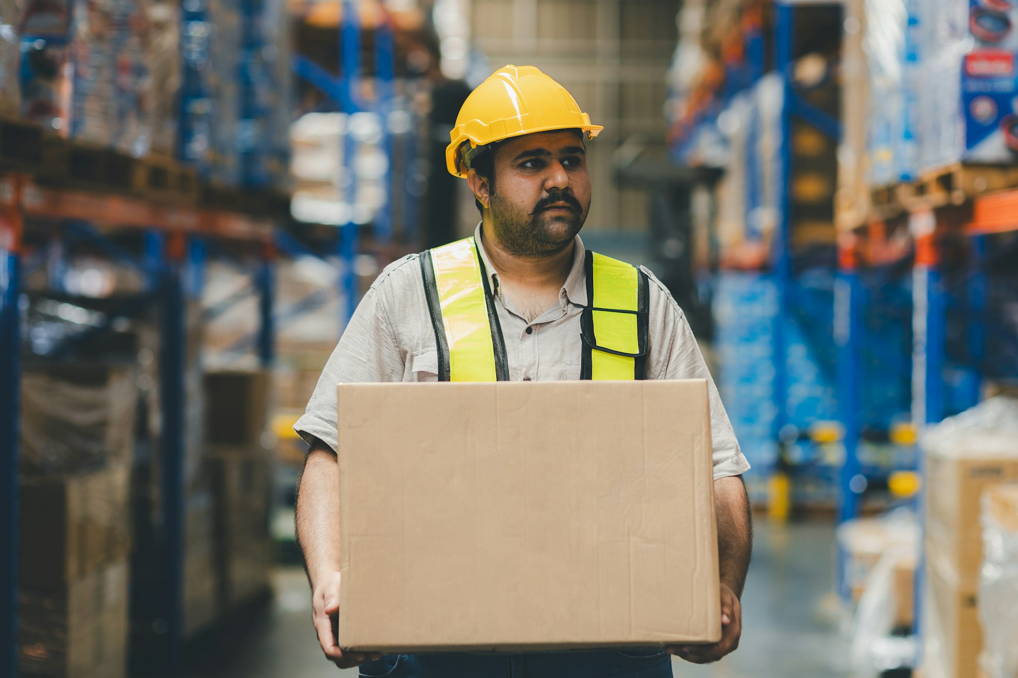 Warehouse worker working in warehouse storage.